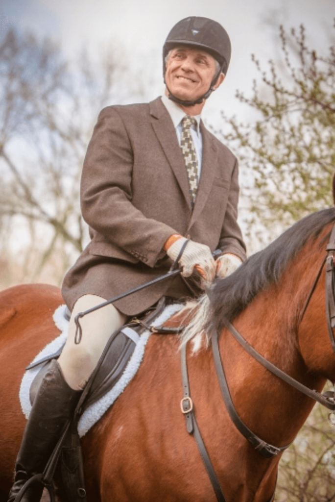 Man in tweed on horse.