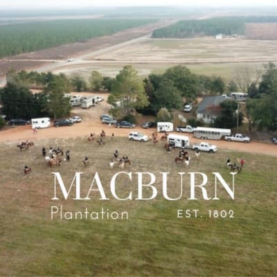 Macburn Plantation aerial image with several riders and horse trailers.