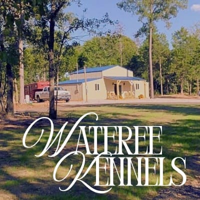 Wateree kennels image with truck and trailer next to yellow building